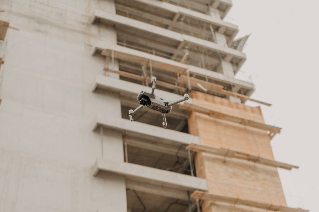 pexels photo 6165166 Aerial drone in flight near a construction site in urban Guatemala.